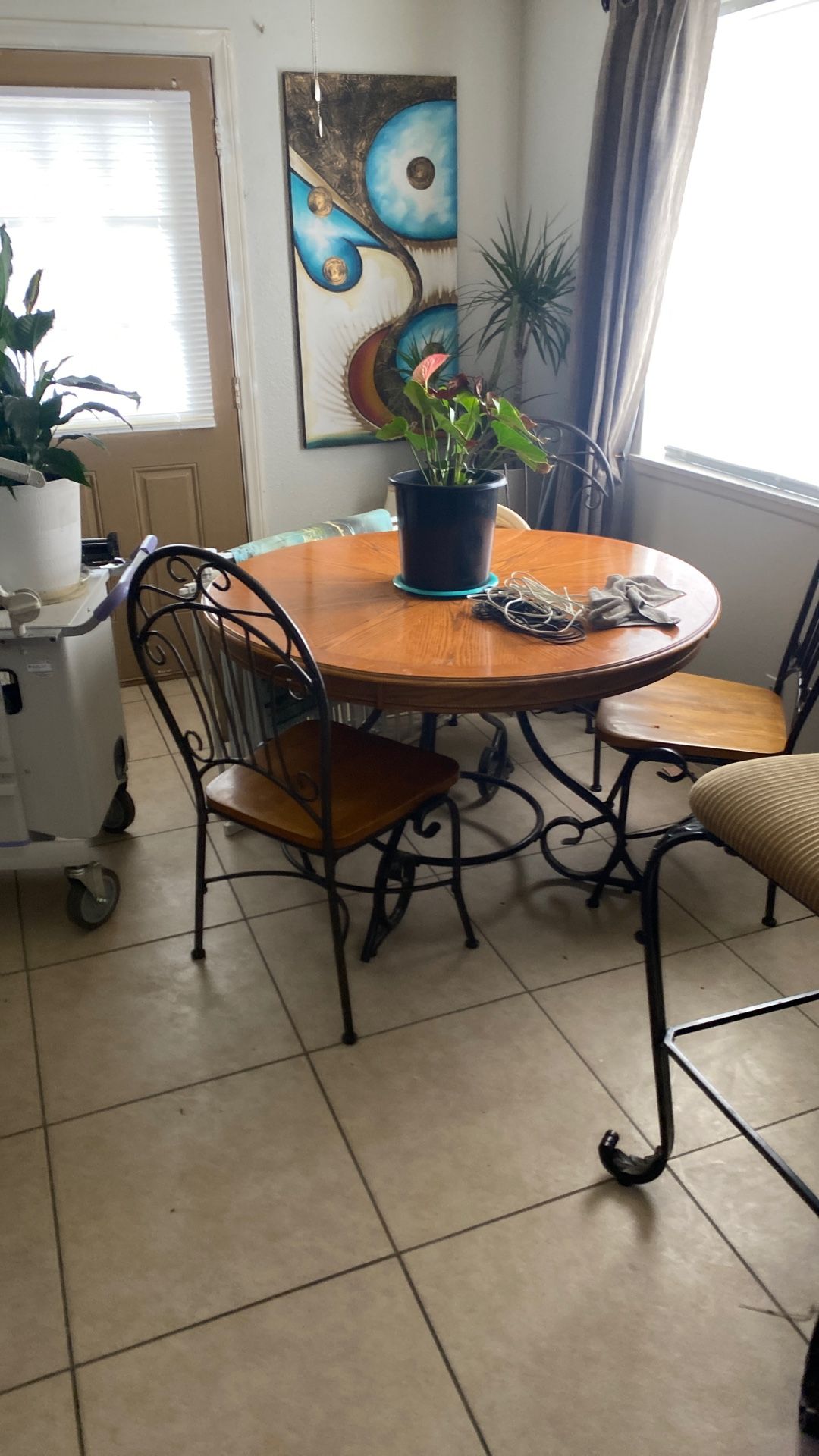 Dining room table for chairs, iron, and wood