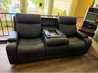 Grey leather movie reclining sofa with massage, heat and Bluetooth speakers built in