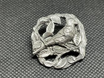This is a vintage Birds & Blooms 1999 pewter cardinal bird brooch pin