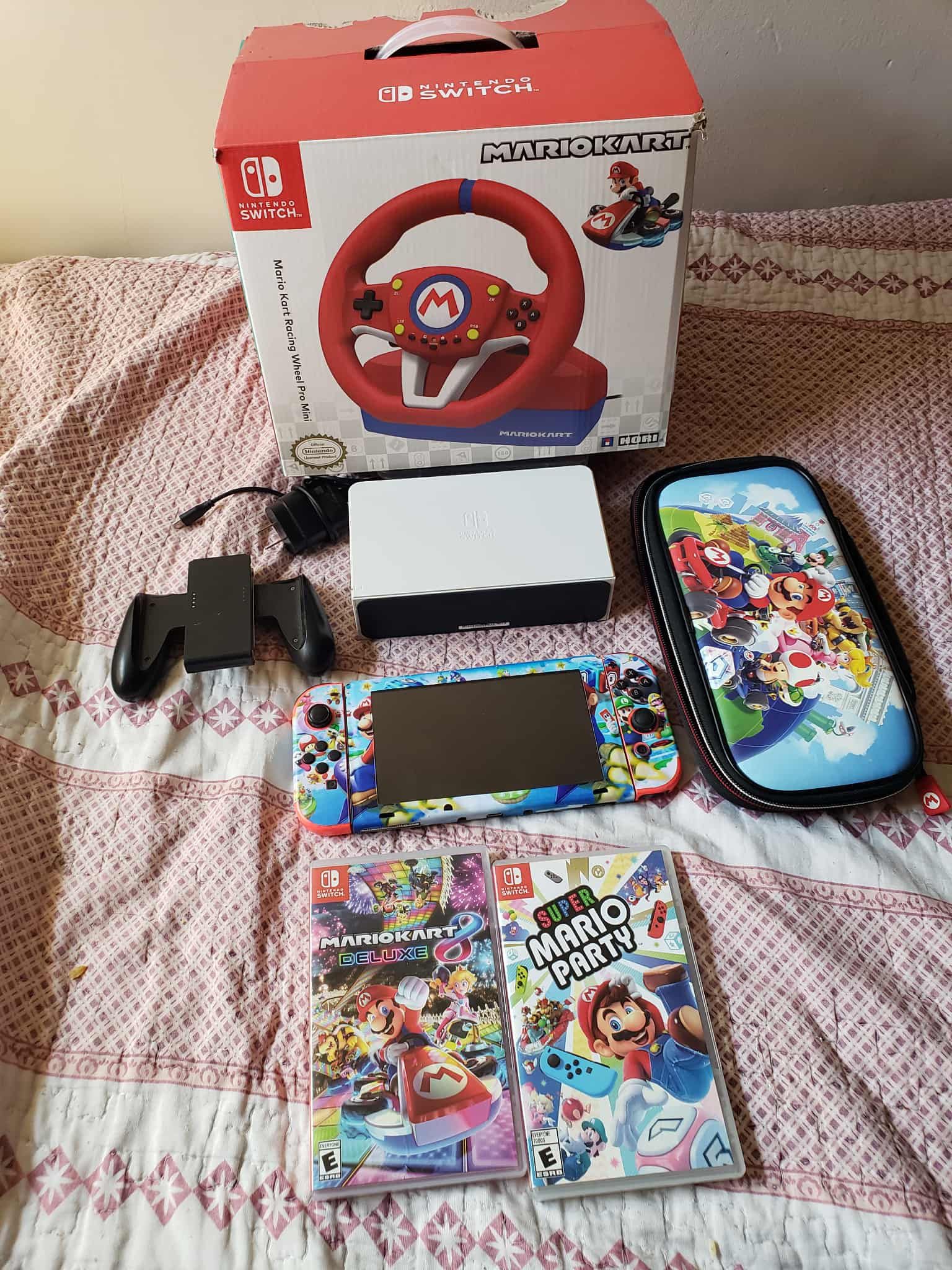 Super Mario Nintendo Switch V2 128GB custom with 2 $65 brand New Games & Racing Mario Wheel with pedels, all you see for $320 firm combo. Less $$$ les