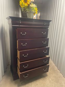 Solid wood tall chest with big drawers. Drawers sliding smoothly