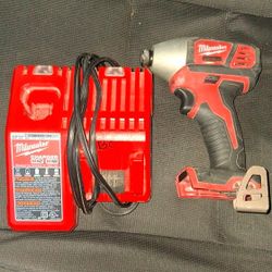 Milwaukee drill and battery charger