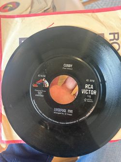 1967 7-inch vinyl 45 RPM single by the Liverpool Five titled "Cloudy" (written by Paul Simon, arranged by Al Capps), released on RCA Victor (catalog n
