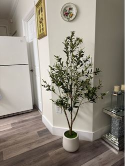 Pretty artificial Olive plant 5 ft tall comes with tall planter ! Brand new