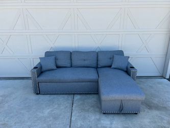 Small Grey Sectional with Rollout Ottoman and Storage  Chaise