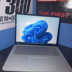 LaptopThis is a Microsoft Surface Laptop Studio in platinum, featuring a unique hinge that allows the screen to pull forward into stage mode.