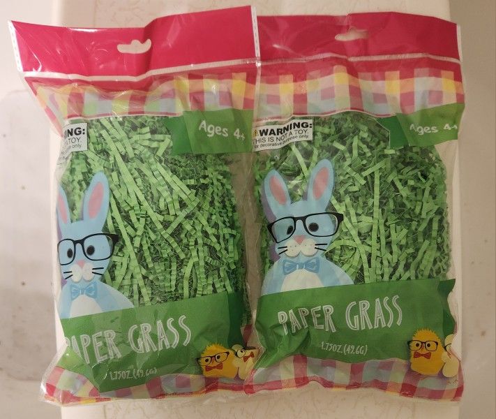 Two Unopened Packages Of Green Paper Easter Grass
