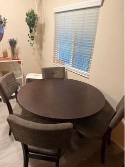 dining room table with four chairs