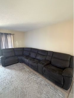 Large modular sectional sofa with power recliners.