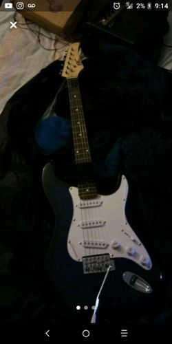 Electric guitar with amp perfect condition for sale or trade for game system