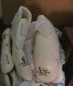 karate pads and beginner outfit