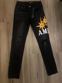 black amiri starburst jeans
