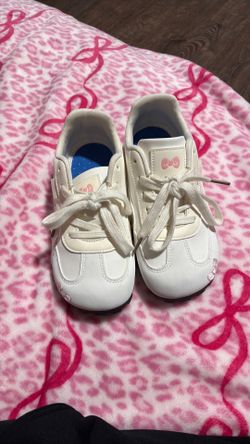 White shoes with pink bows
