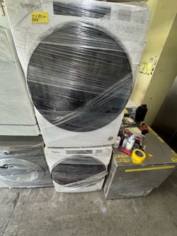 Whirlpool white front loader washer and gas dryer