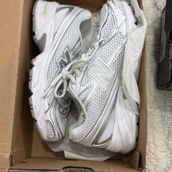 pair of New Balance 740 sneakers in the white and silver colorway