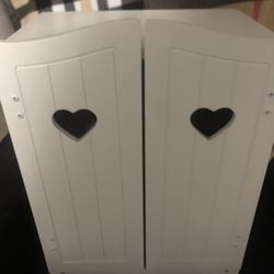 White wooden play armoire/closet for storing and organizes clothing for dolls and stuffed animals