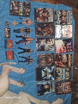 Wwf Collectable Bundle DVDs. 2 Finger Puppets. Action Figures.Vintage Sweat Wrist Bands.Small License Plate