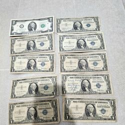 A $2 Bill And Silver Certificate Dollars
