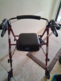 Rolling walker with seat