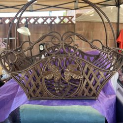 decorative wrought iron lattice basket featuring a grape motif,