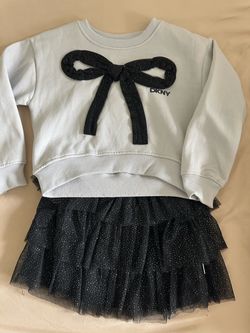 Girls size 5 DKNY sweater and skirt set.