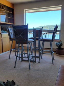Glass Top Table with Leather Chairs