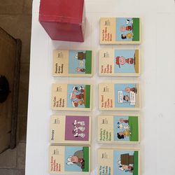 Vintage Peanuts book collection titled “ The world of Charlie Brown”