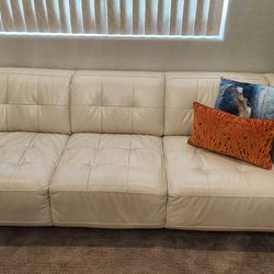 Pair of Macy's leather 3-seater sofas, cream color