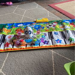 Musical Kids Play Mat W/piano Keys 26”x50”.  Works Great!!! MUSICAL ROCTOPUS BY FISHER PRICE W/14 Instruments. 