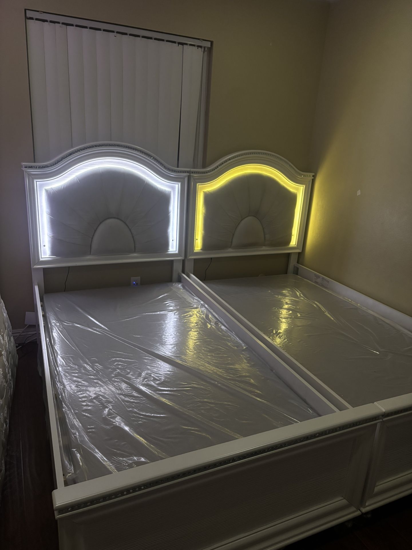 Two Twin L.E.D Beds , Two Spring Box, Nightstand, And Mirror & Dresser.