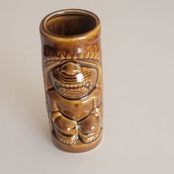 Hawaiian Polynesian Tiki Mug Cup  Vase Brown Barware Glazed  6 1/3" 
tall. Pre-owned, good shape, no chips or cracks.  Weight 13oz plus 
shipping mate
