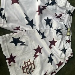 Eric Emanuel EE x Bape 'Stars Logo' athletic shorts in a white colorway.