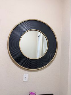 Large black and gold mirror