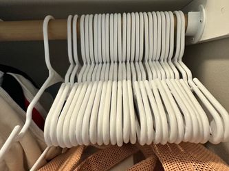 25 barely used baby hangers - FREE