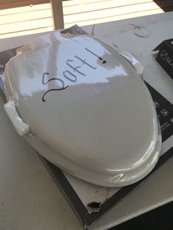 Brand new in the box soft top elongated toilet seat