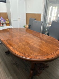 Oval Wood Dining Table with Carved Pedestal Base