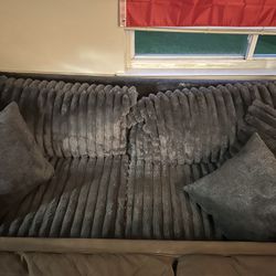 Grey Plush Couch, XL chair, and Ottoman.