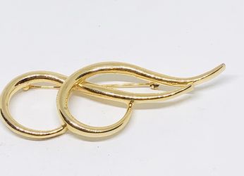 Gold tone brooch
