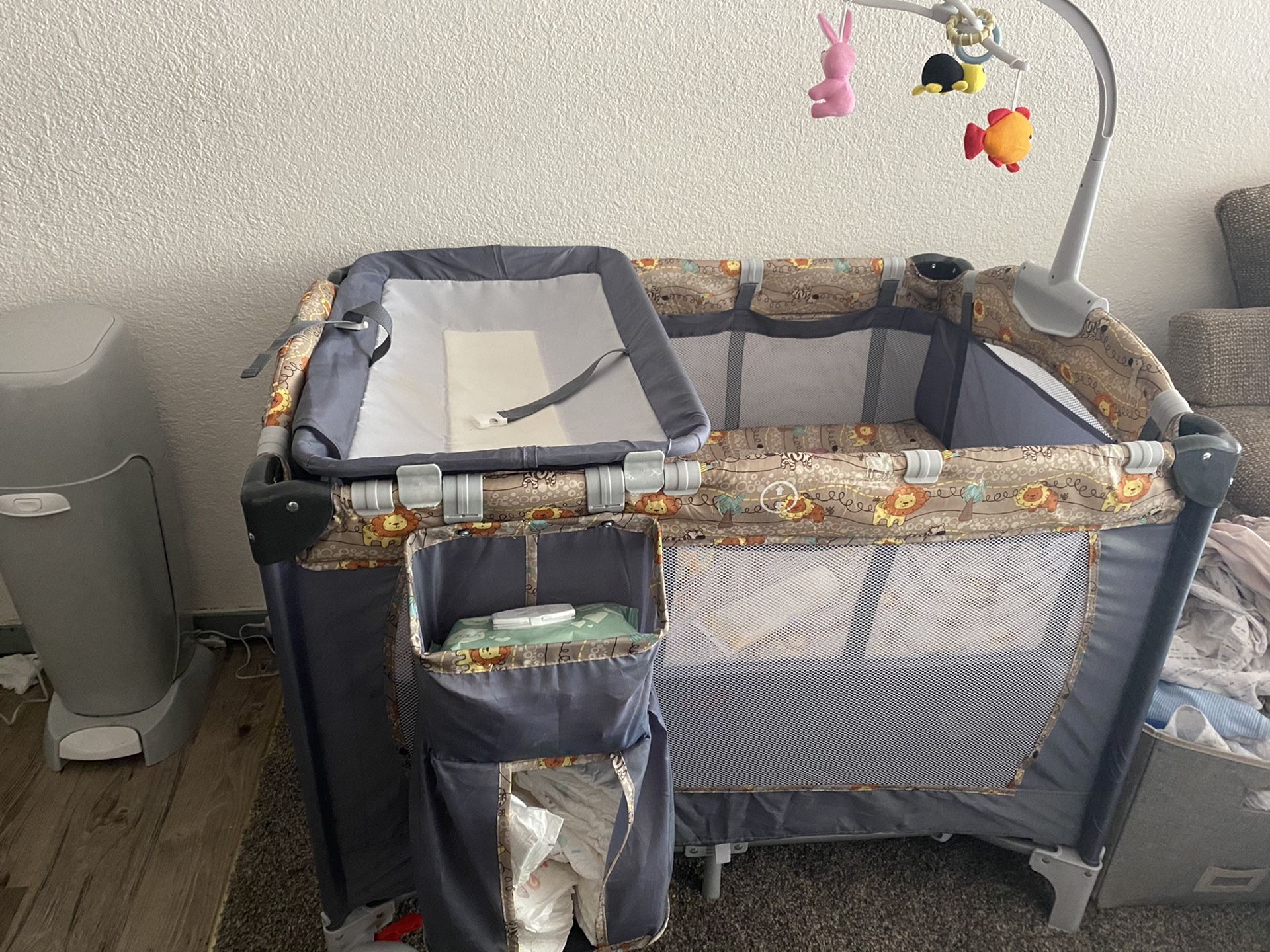Crib/Diaper Changing/Playpen with toys w Wheels