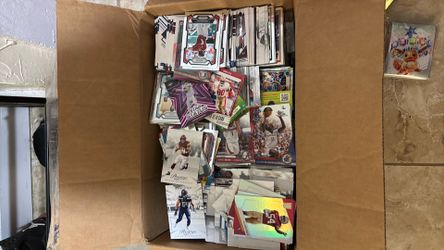 Box of cards a mix of everything baseballs, basketball, football