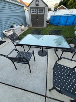 Backyard table and chairs glass and metal