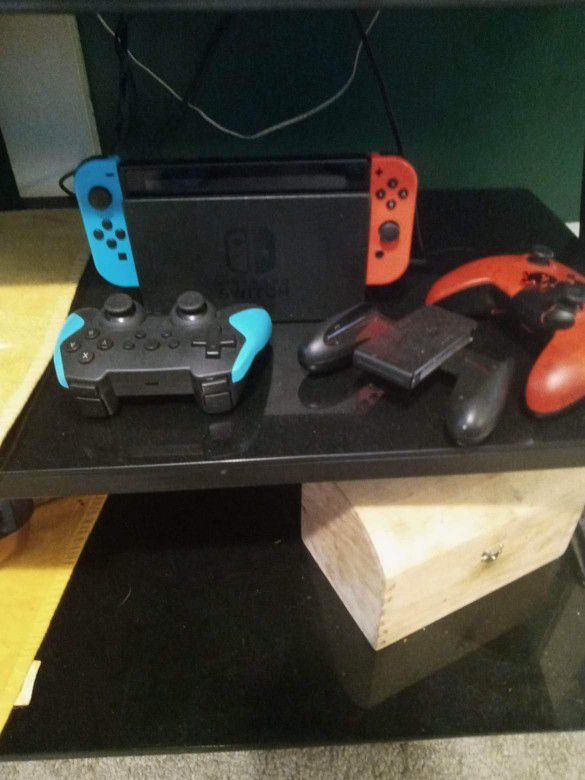 Nintendo Switch Three Controllers And Mario Kart 8