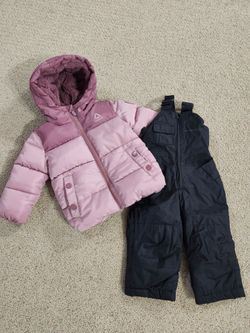 Snow clothes size 12 months baby girl snow bib pants and snow coat in excellent condition. The puffer coat is by Reebok and the bibs are by Weatherpro