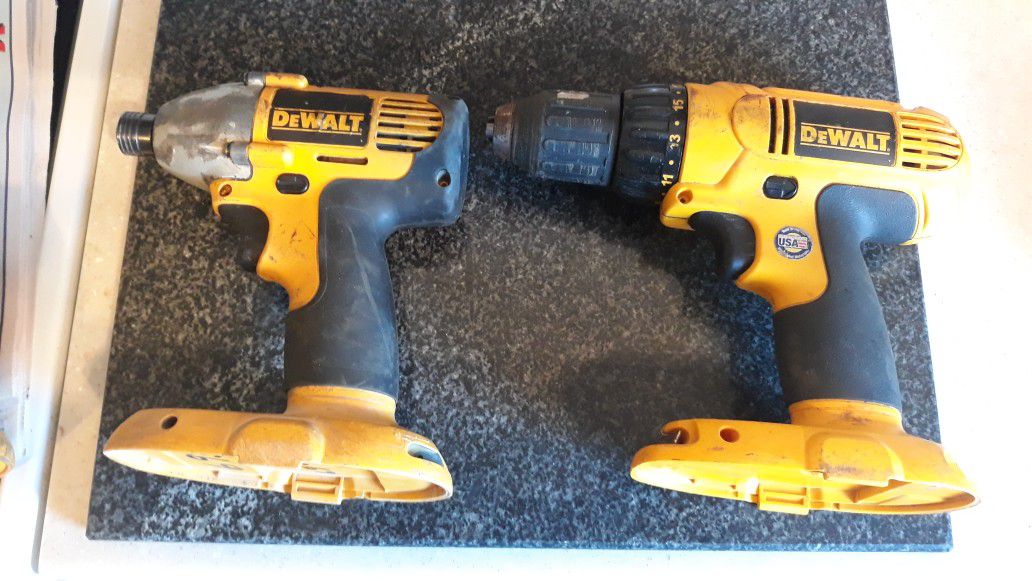 2 Dewalt cordless impact drills (1/4" & 1/2"), cordless flashlight, one battery, and one charger (18 volt)