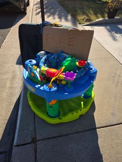 Free baby Evenflo Exersaucer and suitcase