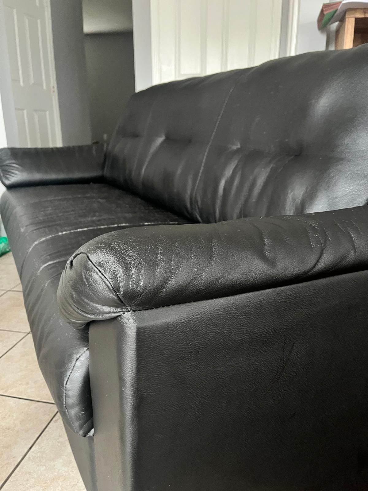 Black faux leather couch
