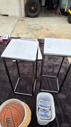 Two standing  decorations tables