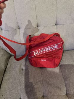 Authentic: limited Supreme red cross body bag.