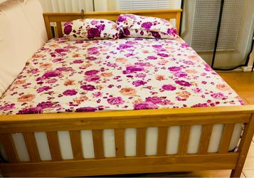 Solid wood full-size bed frame for sale.