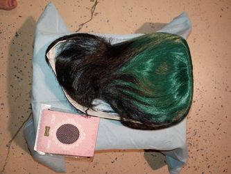 Black and green wig